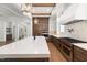 Gourmet kitchen with professional-grade appliances, quartz countertops, custom cabinetry, and a spacious island at 1212 Gunnison Pl, Raleigh, NC 27609