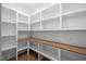 Spacious pantry features custom white shelving and solid surface countertops at 1212 Gunnison Pl, Raleigh, NC 27609