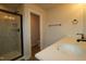 Modern bathroom featuring a glass-enclosed shower, stylish fixtures, and a spacious vanity at 1218 Tredenham Way, Durham, NC 27703