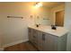 Modern bathroom featuring double sinks, sleek fixtures, and a large mirror for a luxurious feel at 1218 Tredenham Way, Durham, NC 27703