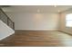 Large open living room area featuring recessed lighting and beautiful hardwood floors at 1218 Tredenham Way, Durham, NC 27703