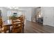 Open dining room with wooden table and chairs, seamlessly connected to the kitchen and living area at 1304 Castlebay Rd, Durham, NC 27703