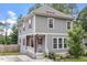 Charming two-story home featuring a welcoming front porch and beautifully landscaped front yard at 1304 Castlebay Rd, Durham, NC 27703
