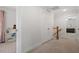 Upstairs hallway with carpeted floors, closets, and entryways to bedrooms at 1304 Castlebay Rd, Durham, NC 27703
