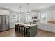 Well-equipped kitchen with stainless steel appliances, quartz countertops, and abundant cabinet storage at 1304 Castlebay Rd, Durham, NC 27703