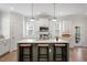 Stylish kitchen island with seating, pendant lighting, and ample countertop space for cooking and entertaining at 1304 Castlebay Rd, Durham, NC 27703