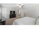 Spacious main bedroom featuring a fireplace, a TV, and entryways to the main bath and closet at 1304 Castlebay Rd, Durham, NC 27703