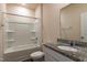 Bathroom featuring a granite countertop, white cabinets, and a shower-tub combo at 1444 Heron Pond St, Raleigh, NC 27604