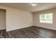 Inviting bedroom features a large window, neutral paint, and modern vinyl plank flooring at 1444 Heron Pond St, Raleigh, NC 27604