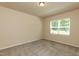 Neutral bedroom with carpeted floor and a window offering natural light at 1444 Heron Pond St, Raleigh, NC 27604