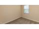 Simple bedroom with carpet, neutral walls, and a window providing natural light at 1444 Heron Pond St, Raleigh, NC 27604
