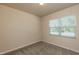 Cozy bedroom with neutral walls, carpet flooring, and a window with blinds at 1444 Heron Pond St, Raleigh, NC 27604