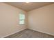 Bedroom with carpet, neutral walls, and a window with blinds providing natural light at 1444 Heron Pond St, Raleigh, NC 27604