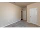 Neutrally painted bedroom with carpet flooring and a closet at 1444 Heron Pond St, Raleigh, NC 27604