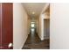 Hallway with wood flooring and neutral walls leading to a bright living space at 1444 Heron Pond St, Raleigh, NC 27604