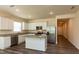 Modern kitchen boasts stainless steel appliances, a center island, and stylish countertops at 1444 Heron Pond St, Raleigh, NC 27604