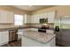 This kitchen shines with stainless appliances, granite counters, and ample white cabinetry at 1444 Heron Pond St, Raleigh, NC 27604