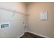 A convenient laundry room features a wire shelf, hookups, and neutral walls at 1444 Heron Pond St, Raleigh, NC 27604