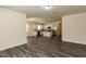 Expansive, open layout with kitchen, living room, and wood-look floors offering modern comfort at 1444 Heron Pond St, Raleigh, NC 27604