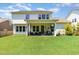 Spacious backyard featuring a covered patio perfect for outdoor dining and relaxation at 1502 Spring Overlook Ln, Hillsborough, NC 27278