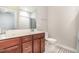 Bathroom featuring a double sink vanity and tile flooring, providing a functional space at 1502 Spring Overlook Ln, Hillsborough, NC 27278