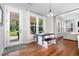 Bright dining area with outdoor access and seamless transition to the living room, perfect for entertaining at 1502 Spring Overlook Ln, Hillsborough, NC 27278