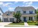 Charming two-story home featuring a well-manicured lawn, attached garage, and welcoming front porch at 1502 Spring Overlook Ln, Hillsborough, NC 27278