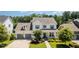 Charming two-story traditional home with a well-manicured front yard and attached two-car garage at 1502 Spring Overlook Ln, Hillsborough, NC 27278