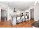 Spacious kitchen with a central island, stainless steel appliances, and seamless transition to other living spaces at 1502 Spring Overlook Ln, Hillsborough, NC 27278