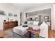 Open-concept living space with a large sectional sofa, smooth flow into the kitchen and dining areas, and modern decor at 1502 Spring Overlook Ln, Hillsborough, NC 27278