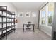 Cozy home office space featuring large windows, neutral paint, built-in shelving, and a desk at 1502 Spring Overlook Ln, Hillsborough, NC 27278