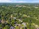Residential neighborhood with mature trees and lush green landscape at 1524 Wedgewood Dr, Graham, NC 27253