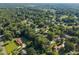 Expansive aerial view showcasing a lush neighborhood with mature trees and well-maintained homes at 1524 Wedgewood Dr, Graham, NC 27253