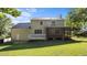 Backyard view of the home and the screened in back porch at 1524 Wedgewood Dr, Graham, NC 27253