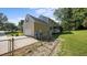 View of a two-story home with a fenced backyard, garage and screened in porch at 1524 Wedgewood Dr, Graham, NC 27253