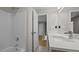 Bathroom boasting a sleek vanity with a quartz countertop and luxurious shower at 1524 Wedgewood Dr, Graham, NC 27253