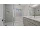 Modern bathroom boasts frameless glass shower and granite vanity at 1524 Wedgewood Dr, Graham, NC 27253