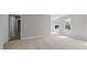 Neutral carpeted bedroom featuring unique arched windows and lots of natural light at 1524 Wedgewood Dr, Graham, NC 27253