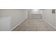Spacious bonus room with soft carpeting and light gray painted walls at 1524 Wedgewood Dr, Graham, NC 27253