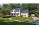 Beautiful two-story home showcasing the well-manicured front yard and landscaping at 1524 Wedgewood Dr, Graham, NC 27253