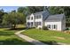 Charming two-story home with well-maintained lawn and inviting walkway at 1524 Wedgewood Dr, Graham, NC 27253