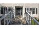 Inviting home entrance with decorative door frame, stone steps and manicured landscaping at 1524 Wedgewood Dr, Graham, NC 27253