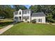 Inviting two-story home with lush green lawn and mature landscaping at 1524 Wedgewood Dr, Graham, NC 27253