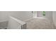 Large loft area with neutral carpet and paint. Natural light from window at 1524 Wedgewood Dr, Graham, NC 27253