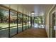 Enclosed outdoor wooden porch with screen panels overlooking backyard at 1524 Wedgewood Dr, Graham, NC 27253