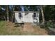Outdoor wooden shed with double doors, two windows, and wooden ramp at 1524 Wedgewood Dr, Graham, NC 27253