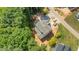 Aerial shot displays the home's roof design, generous lot size, and well-defined driveway at 1529 Lake Adventure Ct, Raleigh, NC 27613