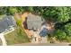 Aerial view of a beautiful home showcasing a spacious lot and private, wooded surroundings at 1529 Lake Adventure Ct, Raleigh, NC 27613
