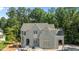 A charming new construction home with grey painted brick, gabled roof, and ample windows at 1529 Lake Adventure Ct, Raleigh, NC 27613