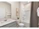 Bright bathroom featuring a shower and tub, neutral tones, and stylish decor at 165 Babbling Creek Dr, Youngsville, NC 27596